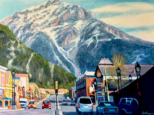 Painting of a mountainous town street with cars and buildings.